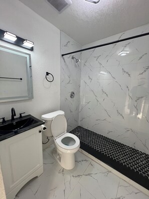 Shower, hair dryer, towels, soap