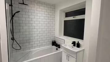 Shower, towels, soap, toilet paper