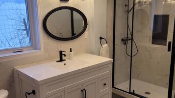 Shower, hair dryer, towels, soap