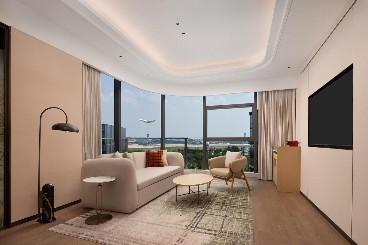 Deluxe Suite, 1 King Bed, Terrace | Living area | LCD TV