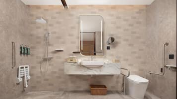 Ein modernes Badezimmer mit Dusche, Waschbecken und Toilette.