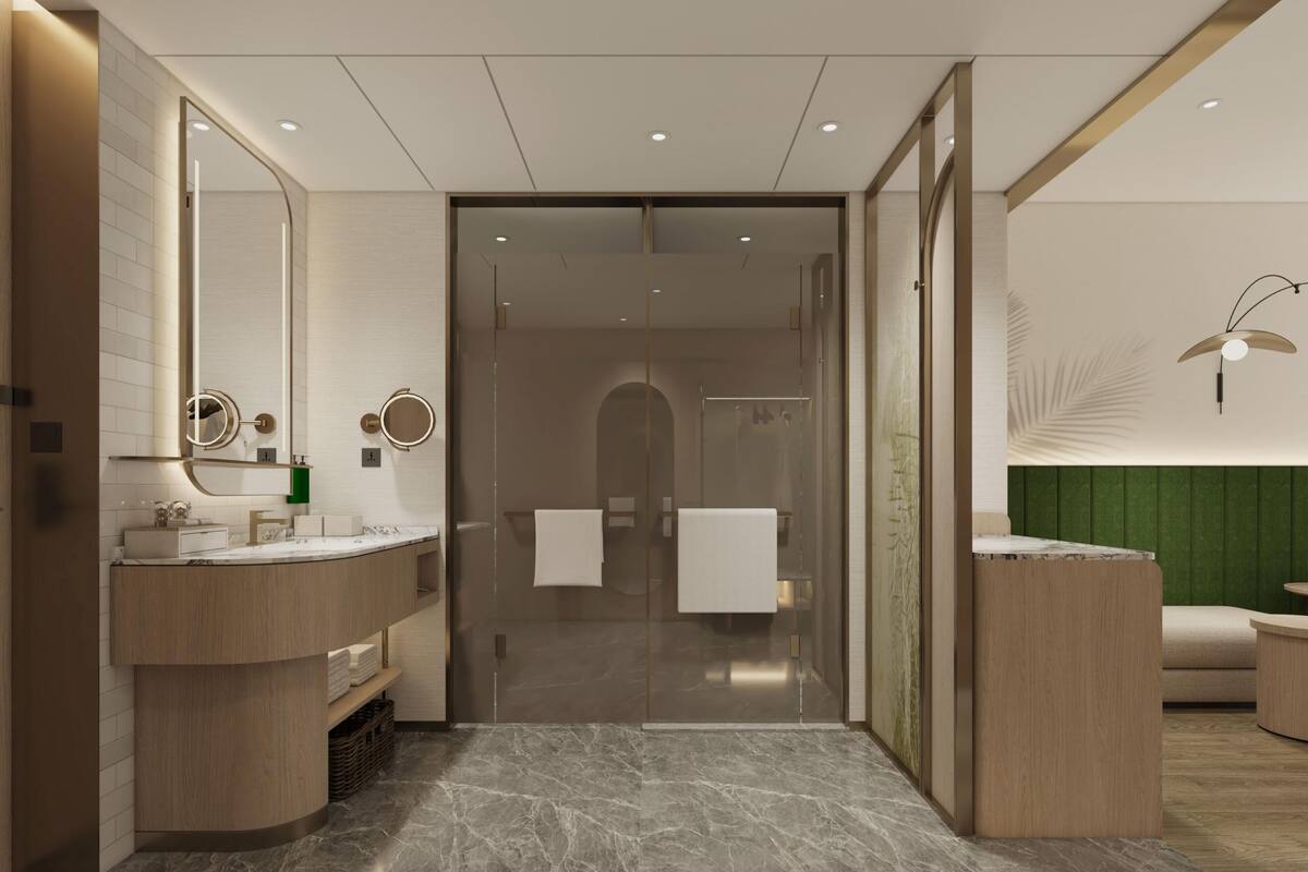 Ein modernes Badezimmer mit Marmorboden, einem großen Spiegel und einer Glasdusche.