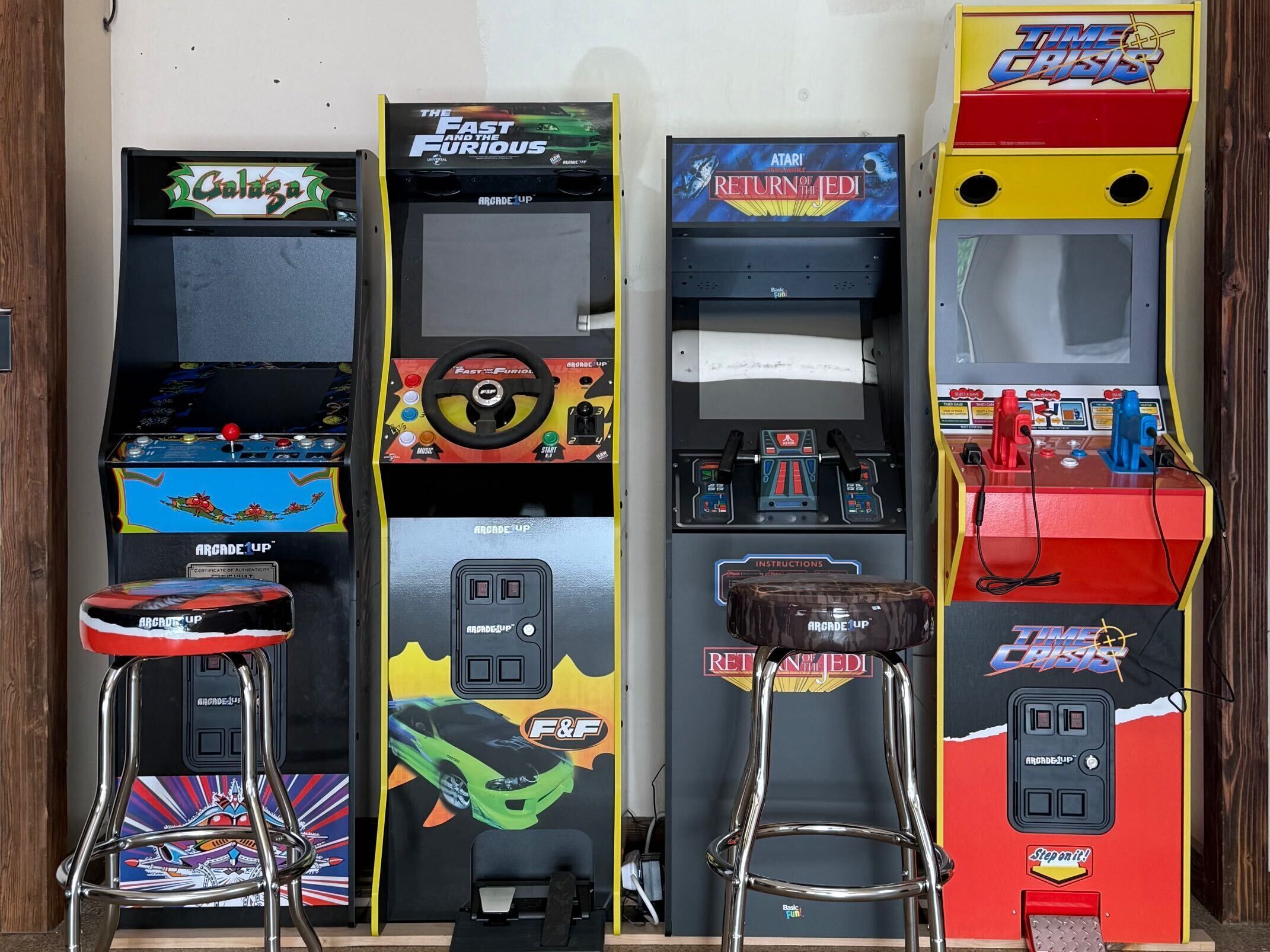 Arcade machines with 'Galaga,' 'The Fast and the Furious,' and 'Time Crisis' titles.