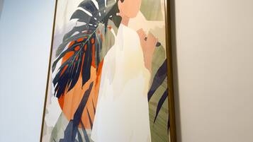 A framed artwork on a wall.