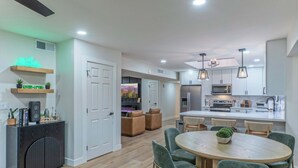 A modern kitchen with a central island, built-in appliances, and pendant lighting. - Fountain Hills Splendor: One Story, Pvt Pool, Putting Green, Fire Pit, Near Hiking/Biking & Golf (Fountain Hills)