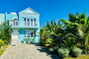 Exterior - Sunset view oceanfront Jamaican townhome with deck (Hanover Parish)