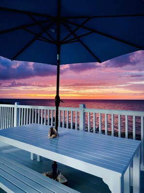 Outdoor dining - Sunset view oceanfront Jamaican townhome with deck (Hanover Parish)