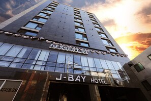 A modern building with a sign for 'Dessert 39' and 'J-BAY HOTEL' indicating a hotel and possibly a dessert shop. -  J-Bay Tourist Hotel  (Seoul)