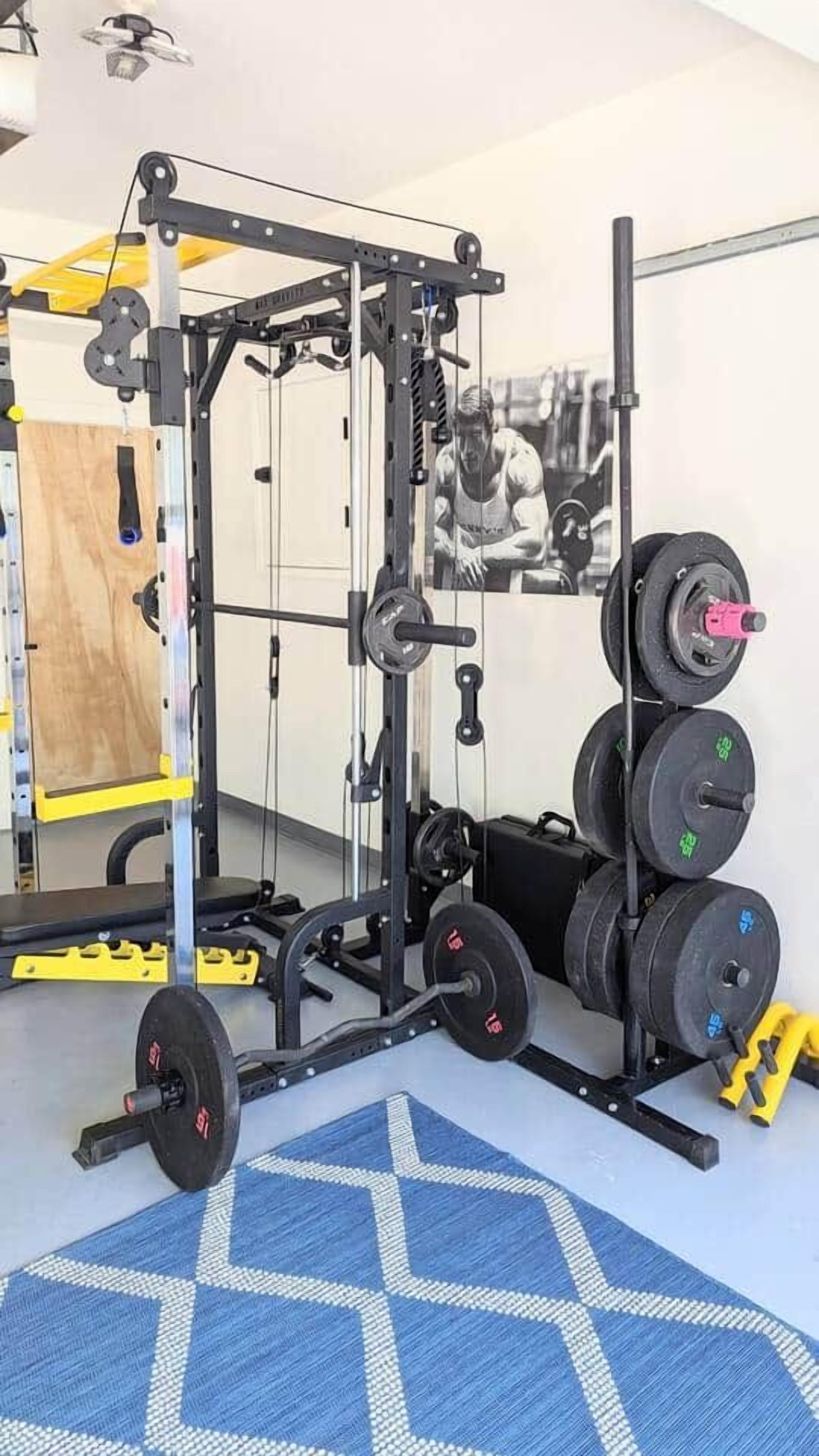 A gym with a squat rack, barbell, and weight plates.