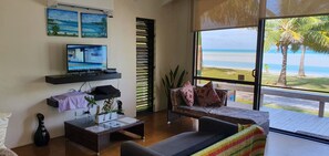 TV, books - 3 Bedroom, 2 Bathroom Beachfront Villa, Restaurants Within Walking Distance (Vaitupa)