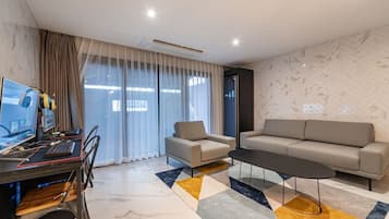 Tomannsrom – familie, flere senger, kjøkken, byutsikt | Oppholdsområde