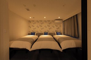 Suite Deluxe | Coffres-forts dans les chambres, rideaux occultants