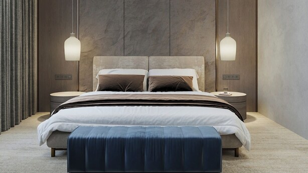 Un dormitorio moderno con una cama grande, dos mesitas de noche y un aplique de pared.