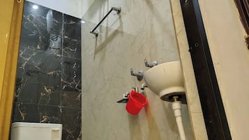 Shower, rainfall showerhead, slippers, towels
