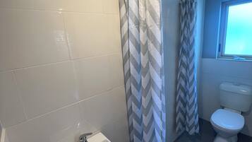 Shower, towels, soap, toilet paper