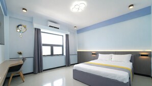 A modern hotel room with a bed, desk, and window. - Palette Amura Hotel - Near Gigamall (Ho Chi Minh City)