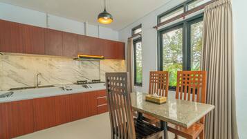 Family Room, Pool View | Private kitchen