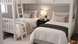 A bunk bed room with a ladder, a bedside table with a lamp, and a teddy bear. - Luxury Content, Event and Rental House + Private Chef Experience - Casa Velour (Maricopa)