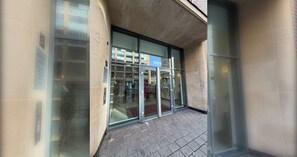 A building entrance with glass doors and a sign indicating 'Montreal House'. - Beautifully Presented 2BDR Flat in Canada Water (Greater London)