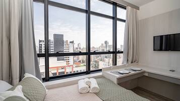 Apartamento executivo | Cortinas blackout, ferros/tábuas de passar roupa, Wi-Fi de cortesia