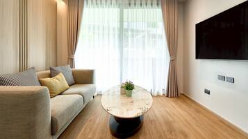 Deluxe-Dreibettzimmer | Wohnbereich