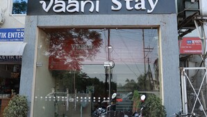 A building with a sign for 'Hotel Vaani Stay' and a 'cbsl group' sign above it.
