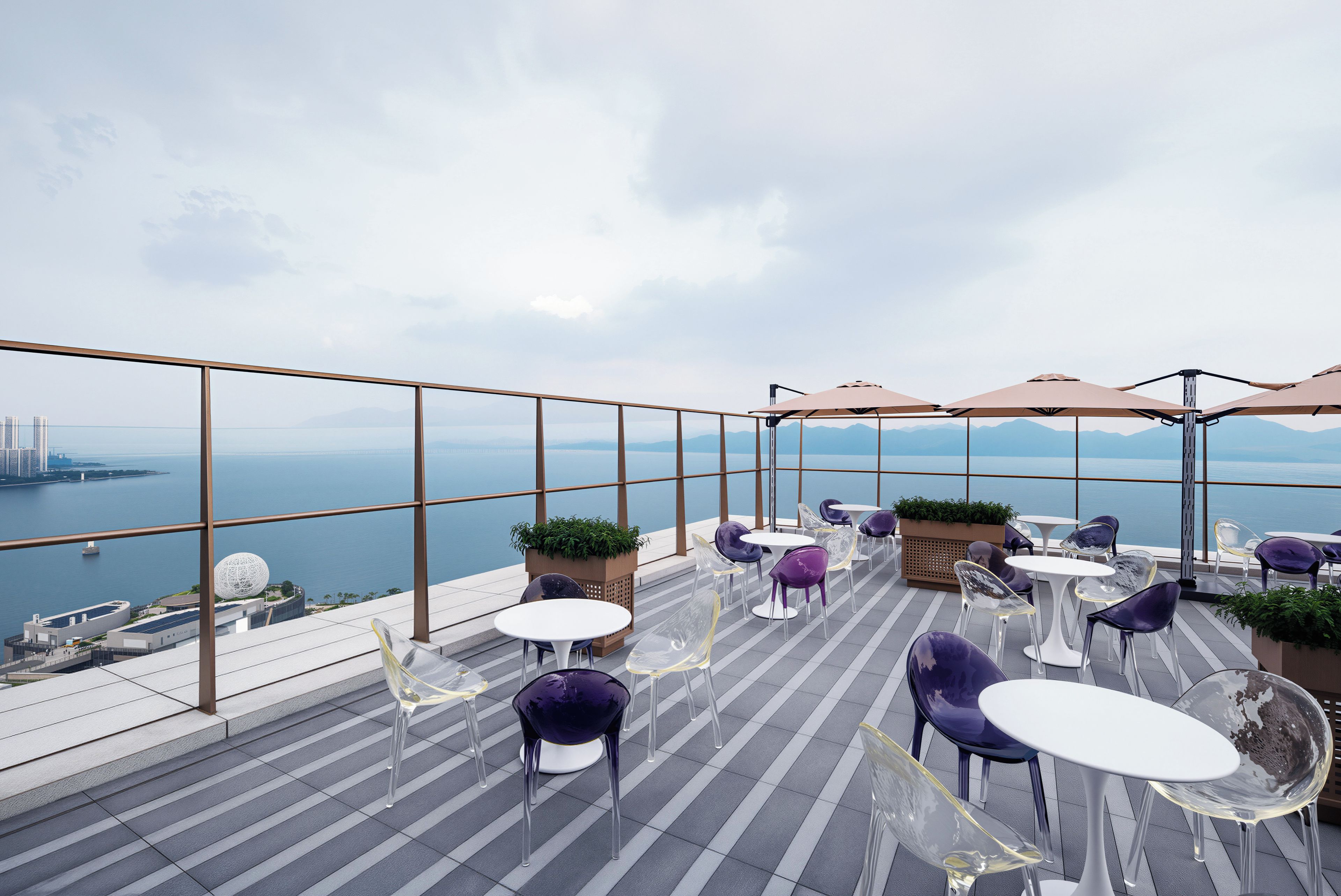 A rooftop terrace with clear views of the sea and city skyline, featuring modern seating and potted plants.