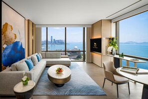 A modern living room with a sofa, coffee table, and a TV. - MGM Shenzhen Prince Bay (Shenzhen)