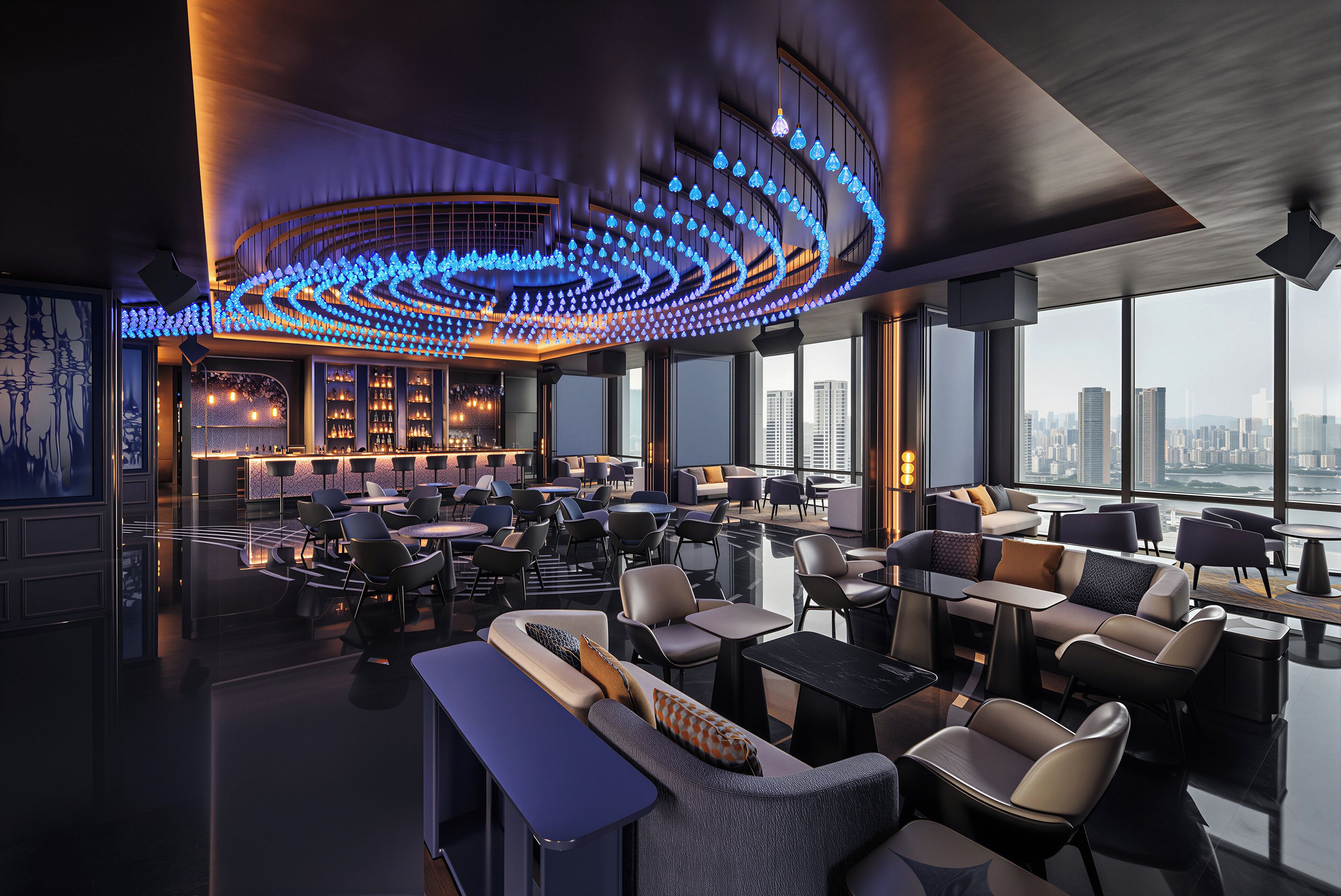 A modern lounge with a curved ceiling light fixture, seating arrangements, and a city view.