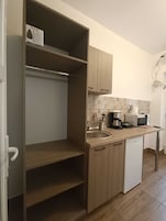 Fridge, microwave, stovetop, cookware/dishes/utensils