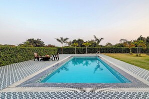 Outdoor pool - ELIVAAS Amaltas 4BHK Hideaway With Pool (Sohna)