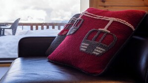 A cabin interior with a window view of snow-covered mountains. - Hauts de Nendaz E by Interhome (Nendaz)