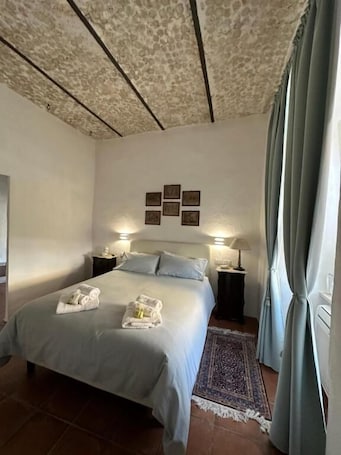 In-room safe, desk, laptop workspace, blackout curtains. resort nuvola srls