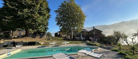 Seasonal outdoor pool, pool loungers