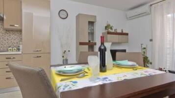 Apartment (One Bedroom Apartment with Balcony) | Living room | Flat-screen TV