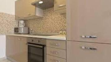 Apartment (One Bedroom Apartment with Balcony) | Private kitchen | Fridge
