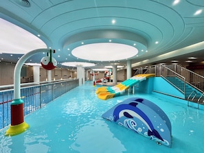 An indoor water park with slides and a dolphin-themed pool area. - Fragrant Hill Empark Hotel (Beijing)