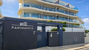 A modern multi-story hotel with a prominent entrance gate labeled 'PANORÁMICA.' - Seaview Apt at Higueron Resort (Fuengirola)