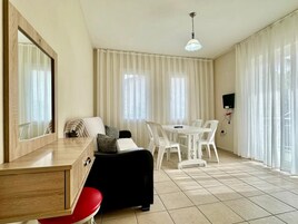 Family Apartment with Land or Pool View | In-room safe, iron/ironing board, free WiFi