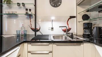 Coffee/tea maker, fridge, stovetop, dishwasher