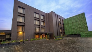 A modern hotel with a large entrance, a boardroom, and a restaurant. - Purple Elephant Luxury Business Hotel (Kanayannur)
