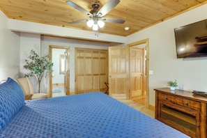 A bedroom with a bed, wooden ceiling, a ceiling fan, a TV, and a dresser. - < 1 Mi to Lake Blue Ridge: Forest-view Gem w/ Deck (Morganton)