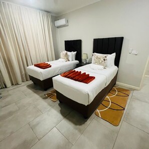 Apartment, 2 Bedrooms, Garden View, Ground Floor | Iron/ironing board, free WiFi - Apartment 110 Victoria Falls Estates (Victoria Falls)