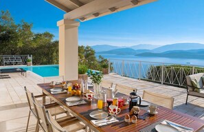Outdoor dining - Omolos House with sea views and solar heated pool (Corfu)