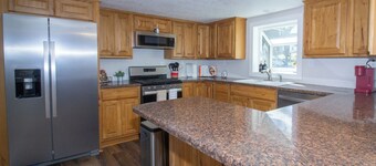 Gasconade Villa is a welcoming three bedroom retreat located near the beautiful Gasconade River in Dixon, Missouri. With one king bed, one queen bed, and four twin beds, this home comfortably accommodates families and groups.