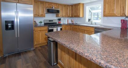 Gasconade Villa is a welcoming three bedroom retreat located near the beautiful Gasconade River in Dixon, Missouri. With one king bed, one queen bed, and four twin beds, this home comfortably accommodates families and groups.