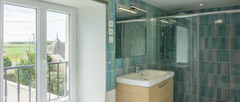 Shower, hair dryer, towels, toilet paper