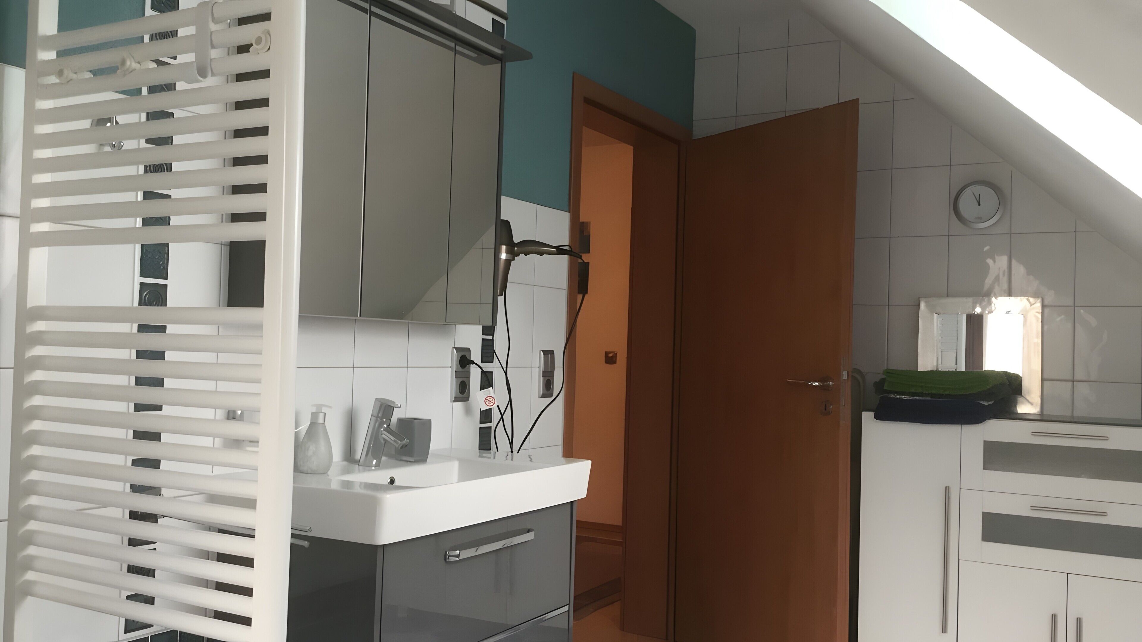 A modern kitchen with a built-in oven, a sink, and a countertop.