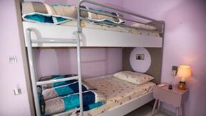 A bunk bed room with a bedside table and lamp. - Persefoni s Village House in Messara (Gortyna)