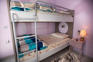 A bunk bed room with a bedside table and lamp. - Persefoni s Village House in Messara (Gortyna)